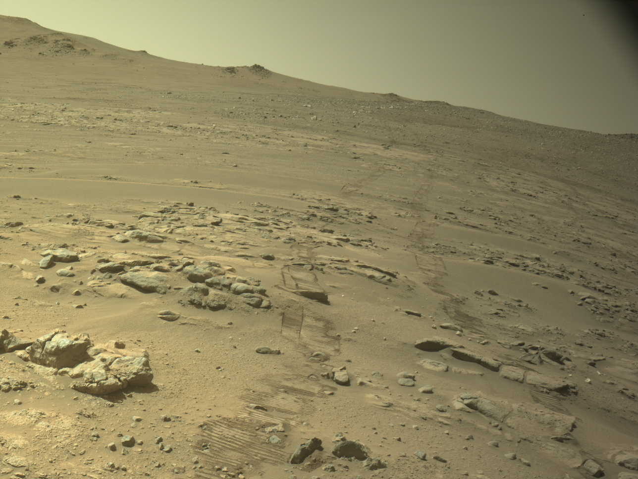 Perseverance rover tracks crossing rocky, sloping Martian terrain on October 11, 2026.